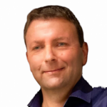 Foto von Roland Klawitter: Mann mit dunkelblauem Hemd lächelt